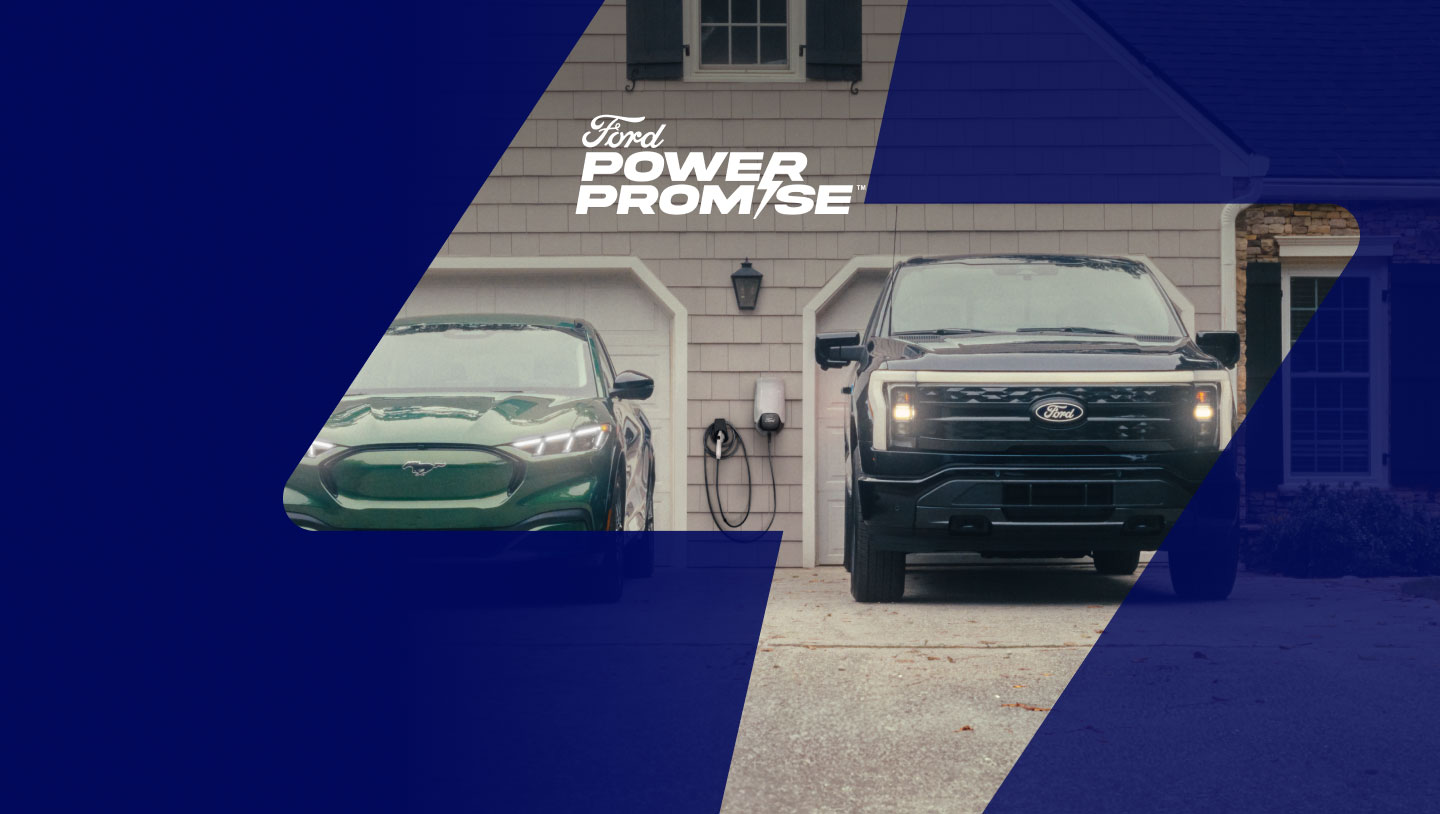 A Mustang Mach-E® and F-150 Lightning® sitting in a driveway with Ford Connected Charge Station hanging on the wall of the garage.