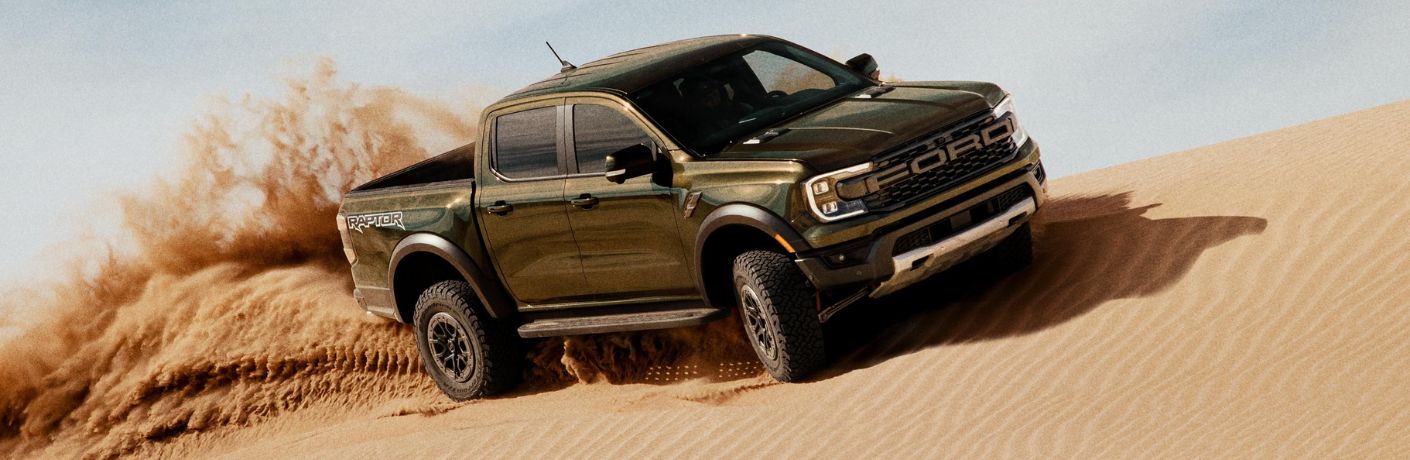 Green 2026 Ford Ranger Raptor in Sand Dunes