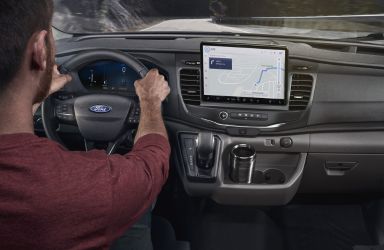 Man Behind the Wheel of 2026 Ford Transit with New Touchscreen Display