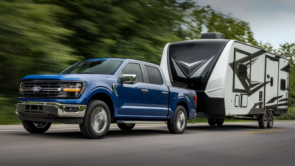 Blue 2025 Ford F-150 Towing a Camper