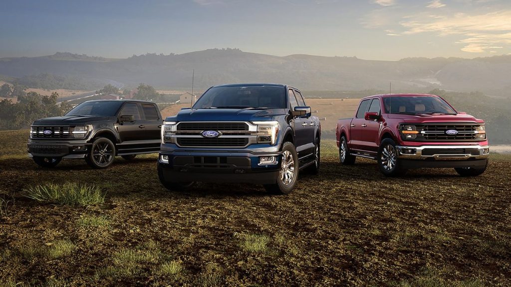 Black, Red, and Blue 2026 Ford F-150 Models in a Field