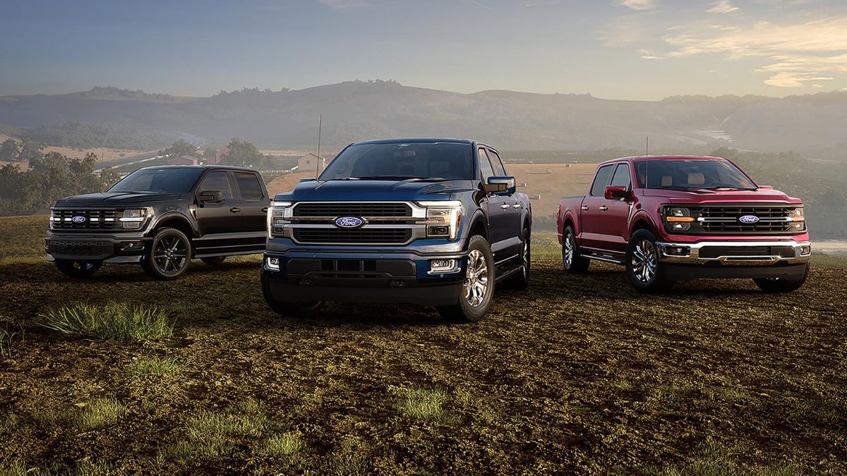 Black, Red, and Blue 2026 Ford F-150 Models in a Field