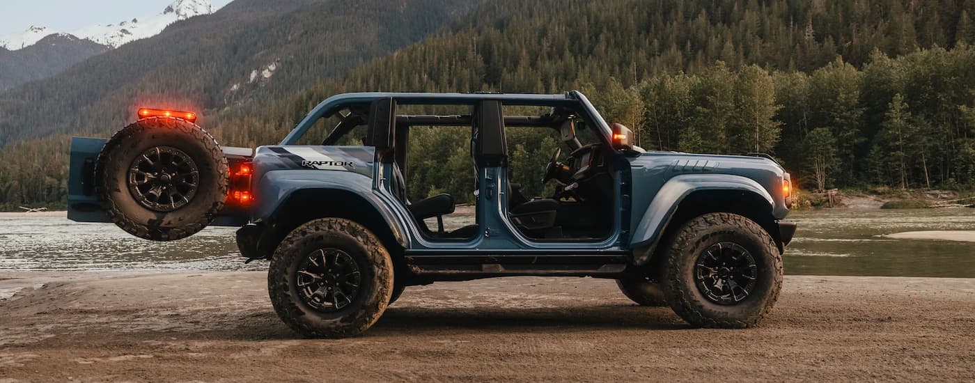 Side of a blue 2025 Ford Bronco Raptor with removed doors