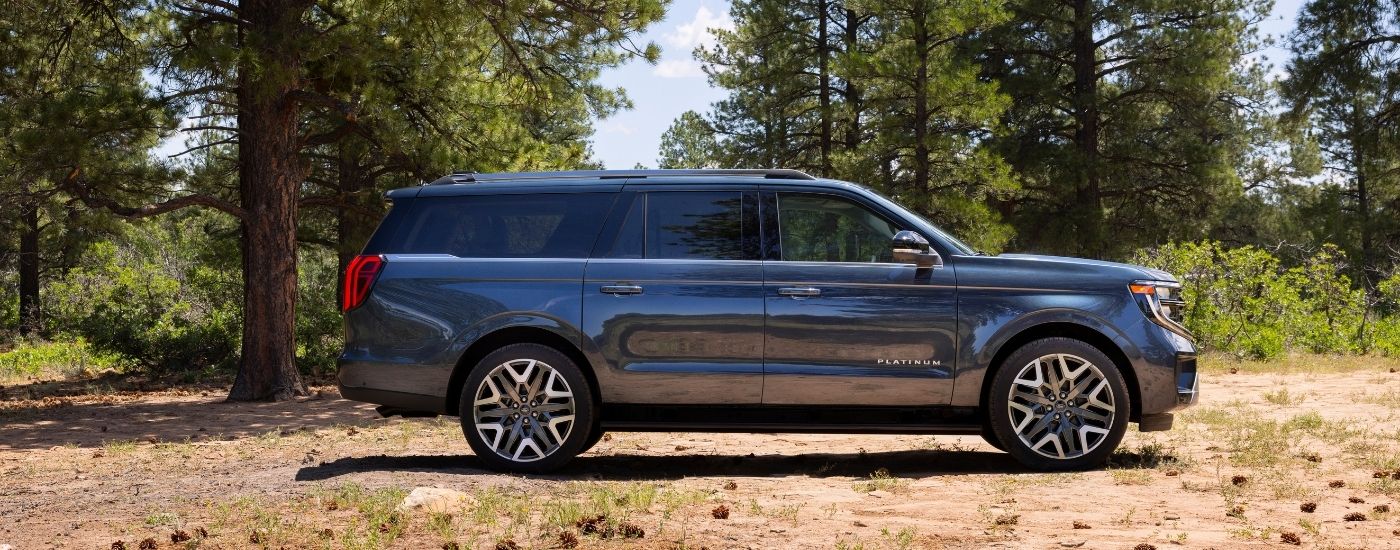 A blue 2025 Ford Expedition from the side.