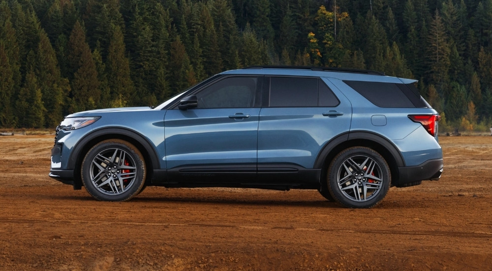 Blue 2025 Ford Explorer ST parked off-road