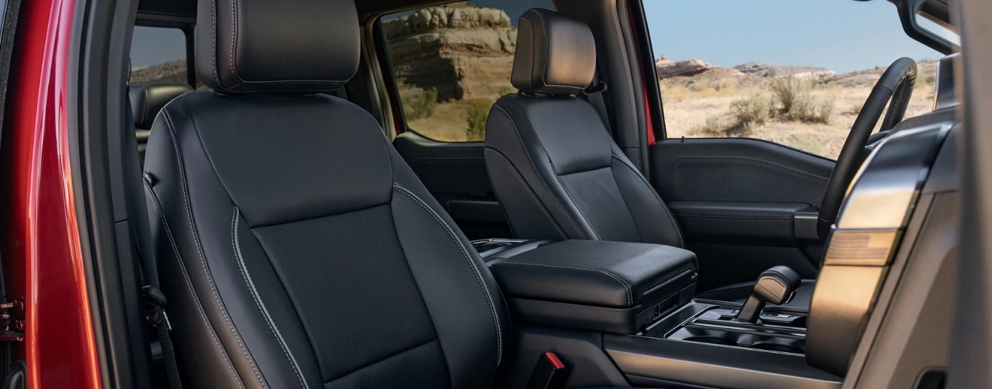 Black leather seats in a red 2025 Ford F-150.