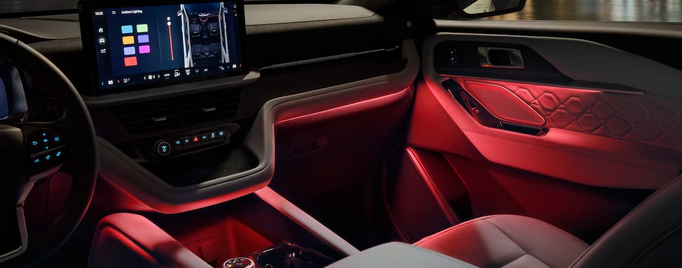Red illuminated interior of a 2026 Ford Explorer