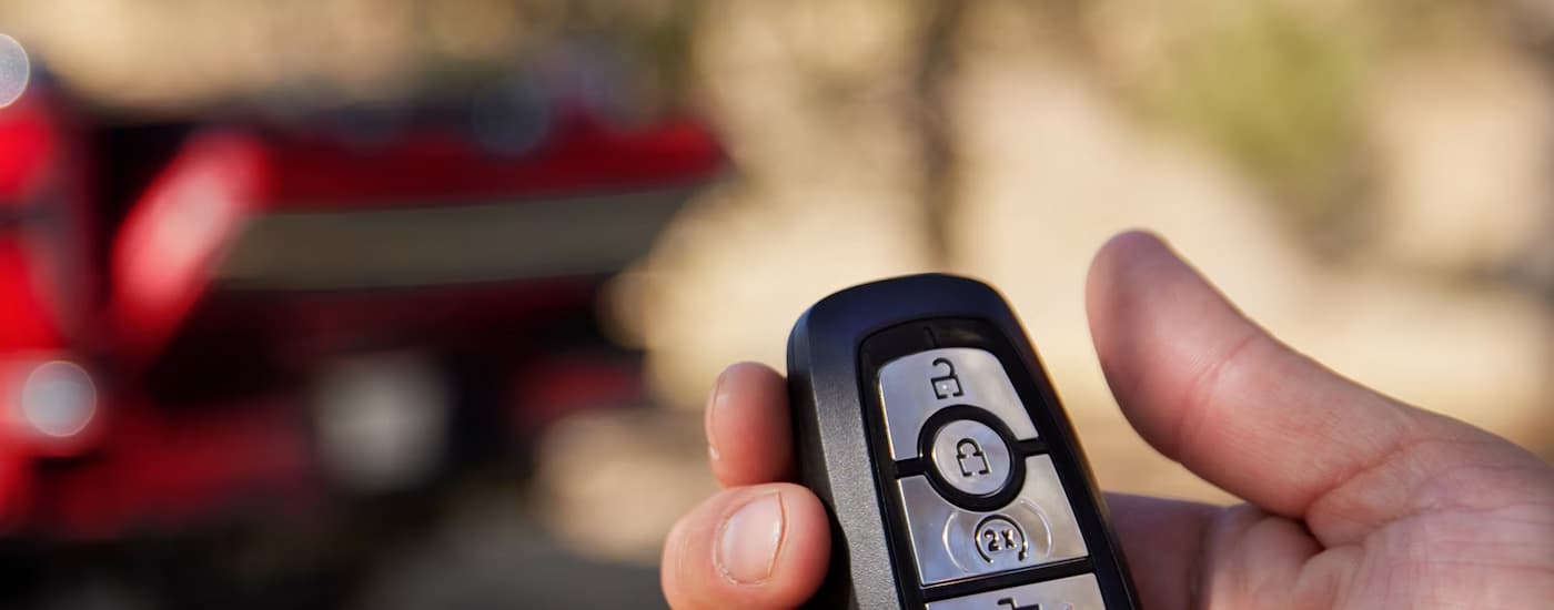 Keyfob opening the liftgate on a red 2026 Ford F-250