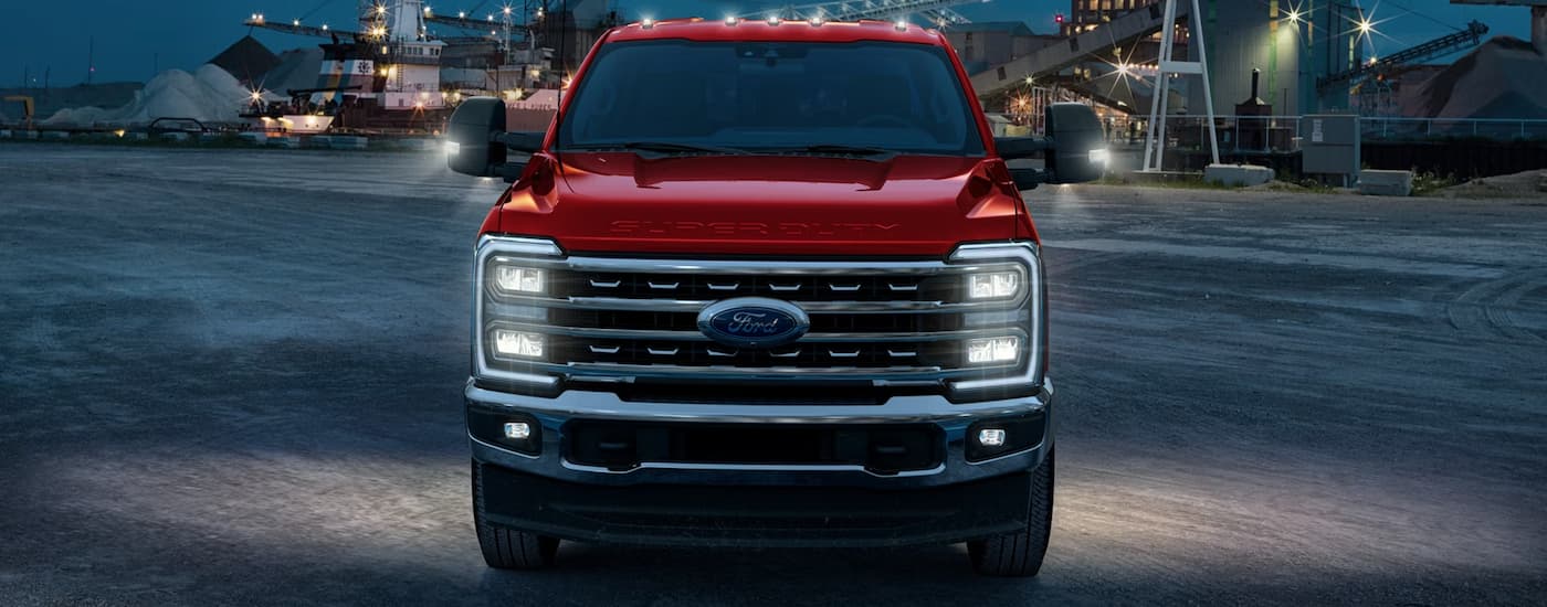 Front of a red 2026 Ford F-250 parked at night