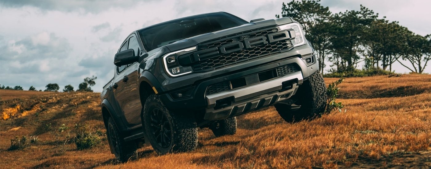 Black 2026 Ford Ranger Raptor parked off-road