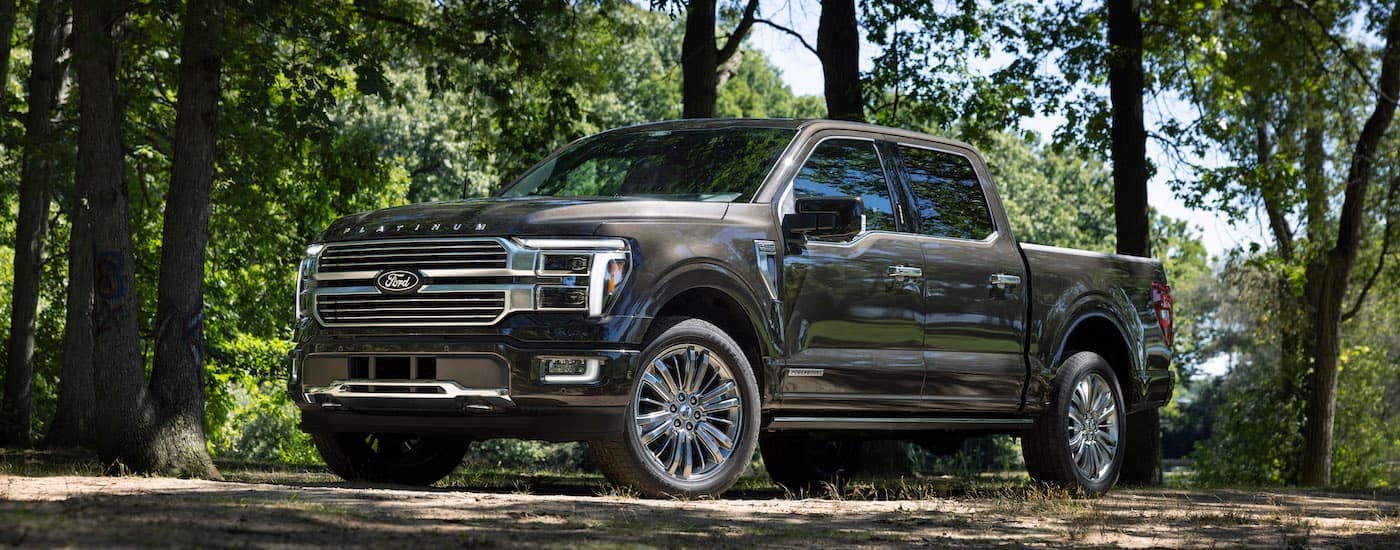A grey 2024 Ford F-150 from the side after leaving a Ford dealer.