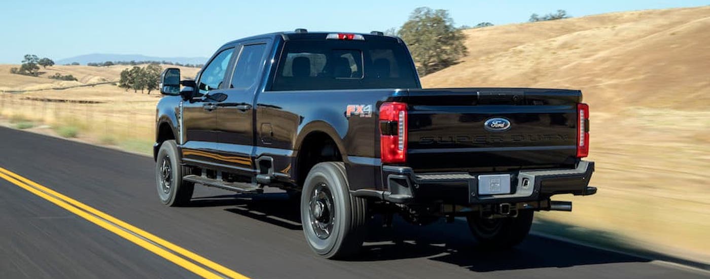 A black 2025 Ford F 250 from the rear at an angle.