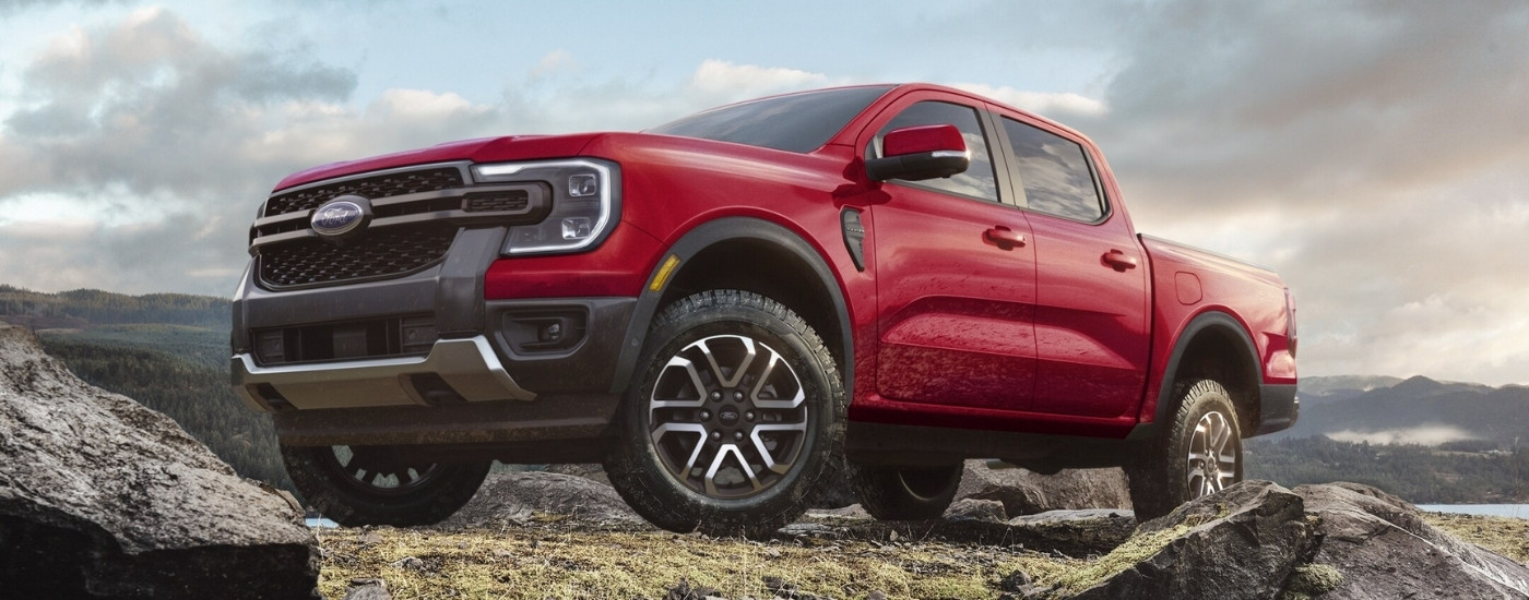 Red 2025 Ford Ranger Lariat off-roading on a rocky trail