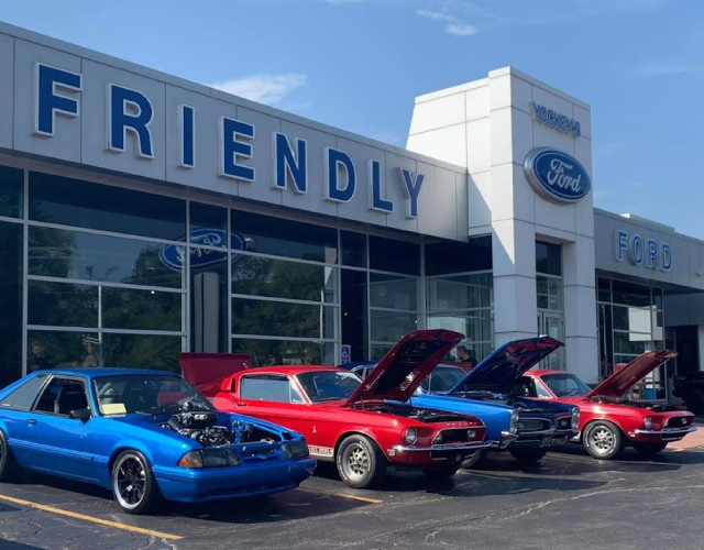 Row of Cars in Front of Friendly Ford Dealership
