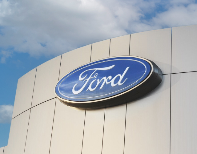 Friendly Ford Logo on Ford Dealership Building