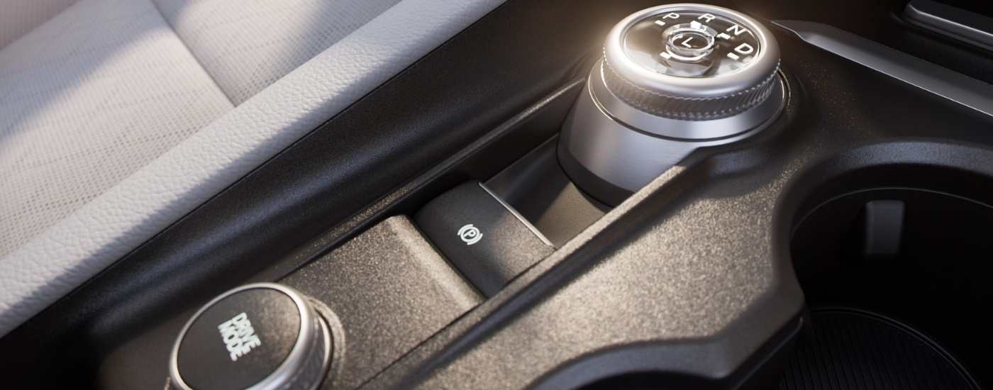 Gear selector and drive mode knobs in a 2025 Ford Explorer Active.