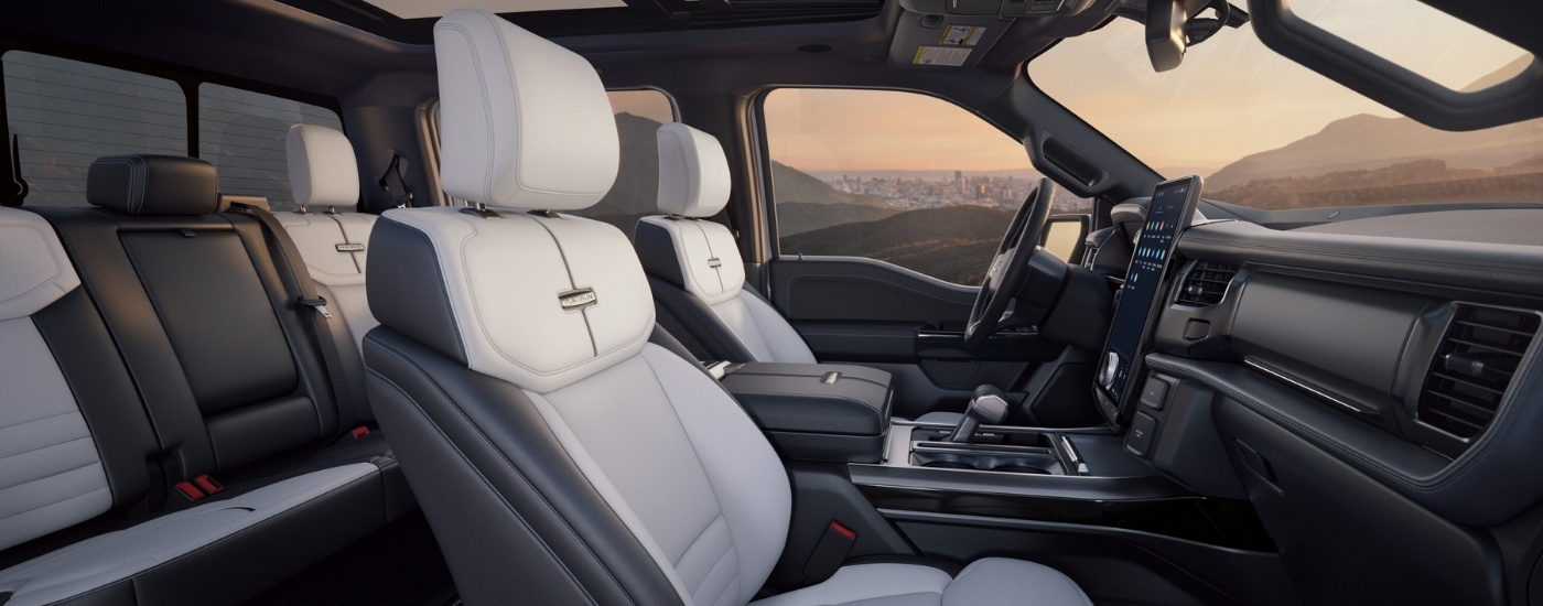 Black and white leather interior in a 2025 Ford F-150 Lightning Platinum.