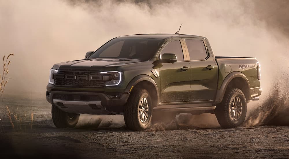 A black 2026 Ford Ranger Raptor off-roading in dirt