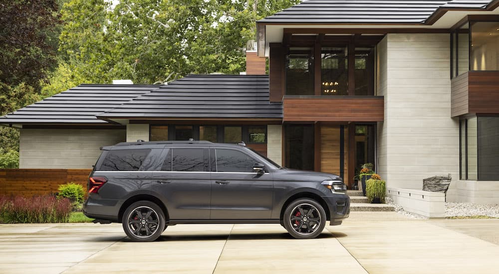 A grey 2022 Ford Expedition Stealth Edition Performance Package is shown from the side parked on a driveway.