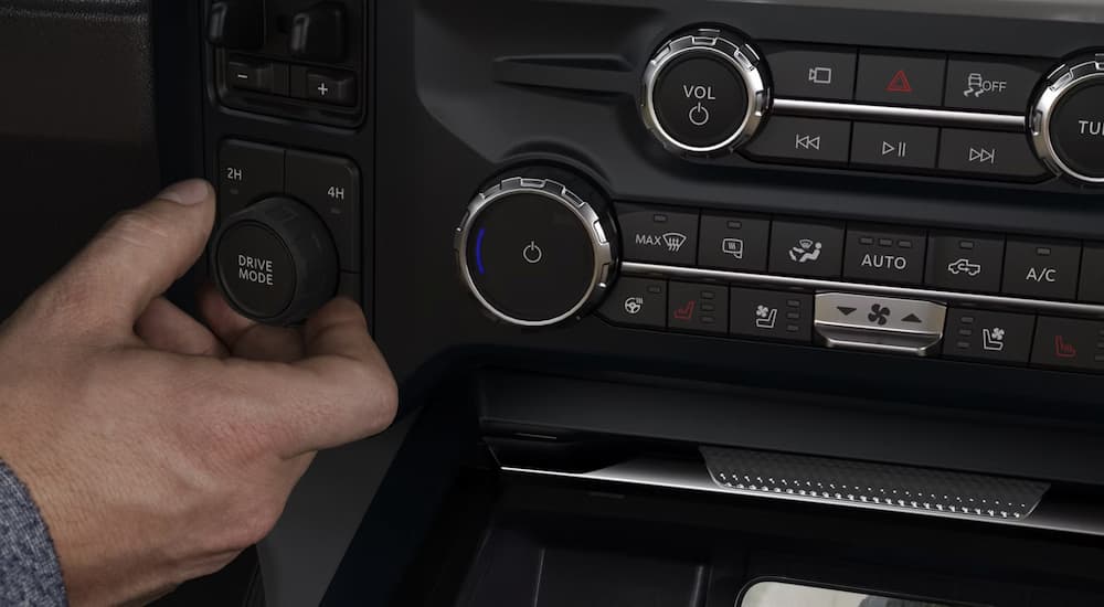 Person using buttons in a 2026 Ford F-250