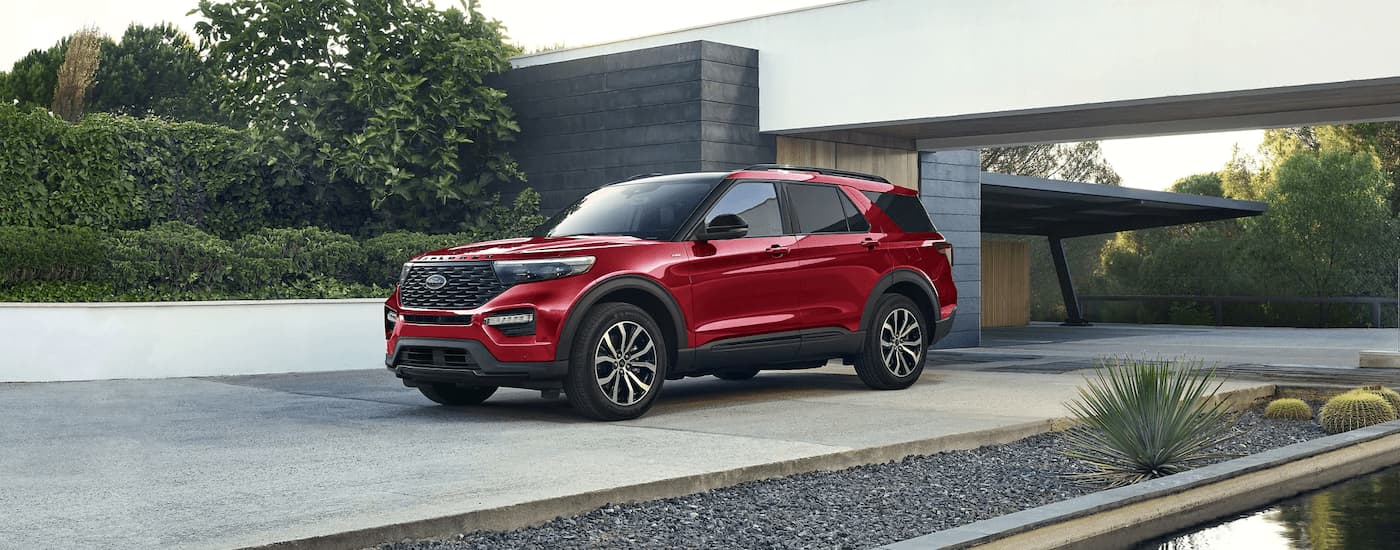 A red 2023 Ford Explorer ST for sale near Folsom, CA is shown in a driveway.