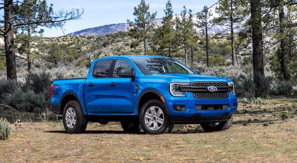 A blue 2025 Ford Ranger from the side.
