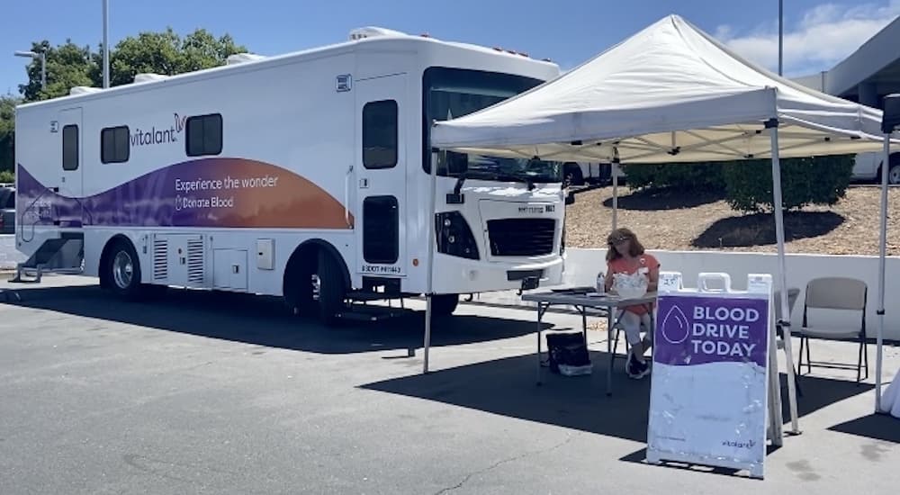 A tent and bus are shown at the Future Ford of Sacramento blood drive.