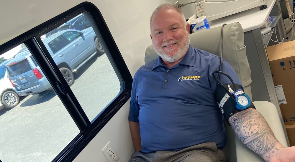 A Future Ford of Sacramento employee is shown getting their blood drawn.