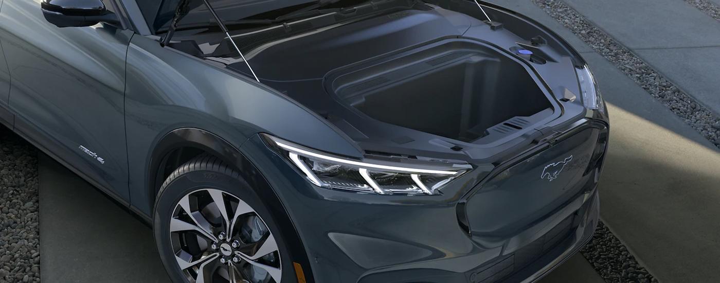 A close up of the frunk on a grey 2023 Ford Mustang Mach-E is shown at a Sacramento EV dealer.