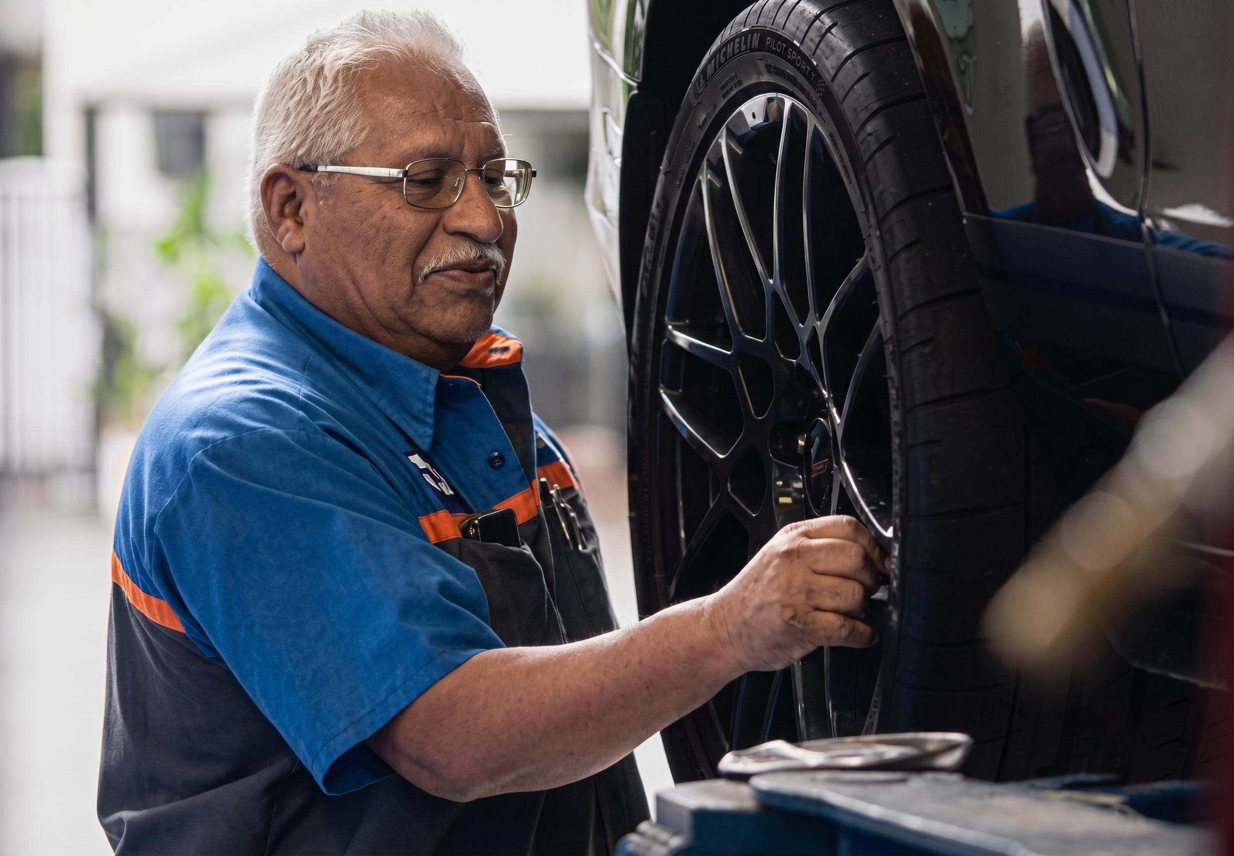 Galpin Ford Service Tech Changing Tire