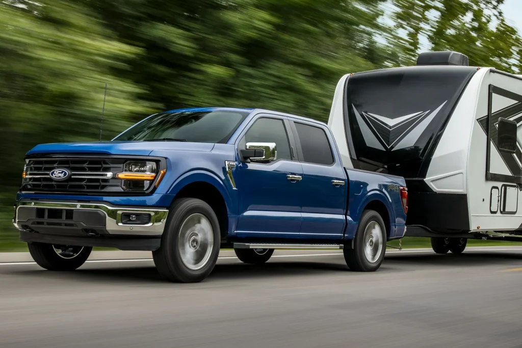 blue Ford F150 Towing Trailer