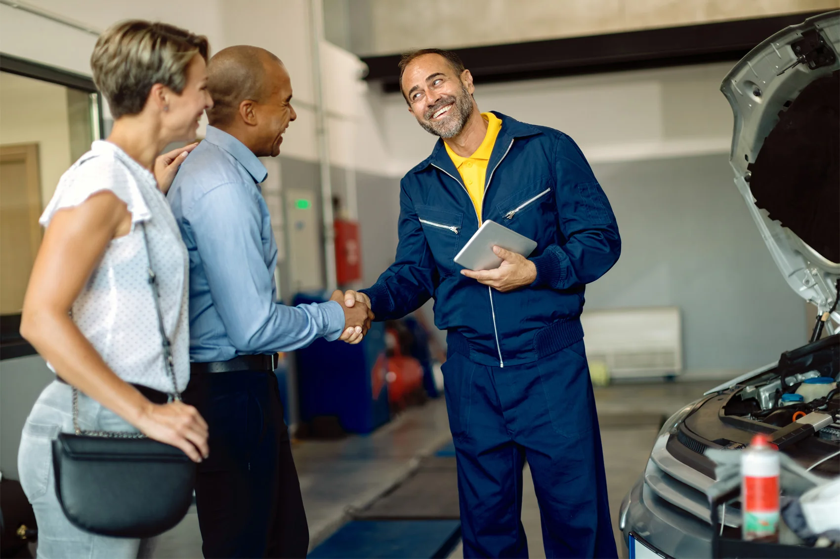 Technician servicing a Ford vehicle with genuine parts at Leif Johnson Ford