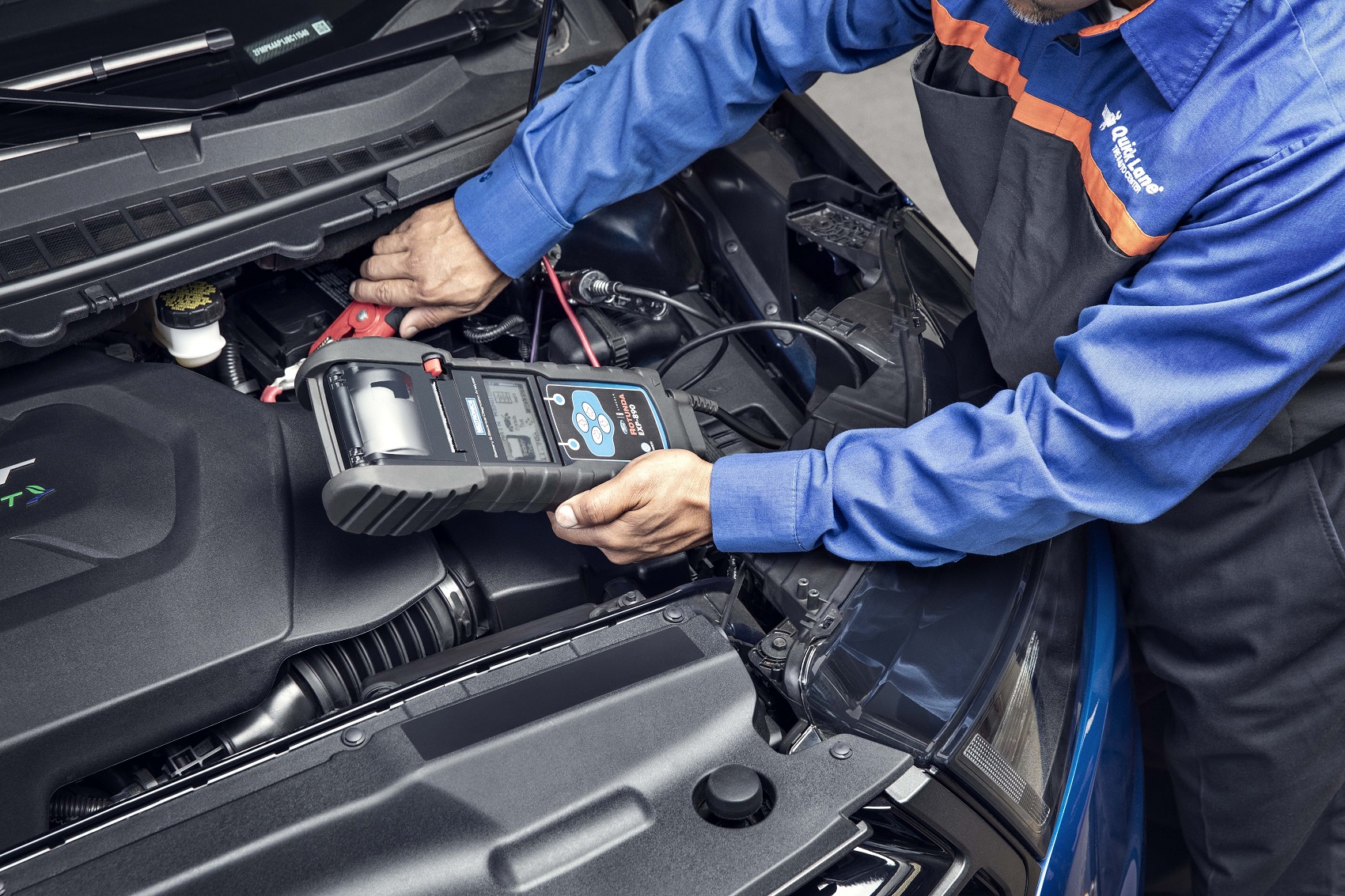 Ford technician servicing a vehicle