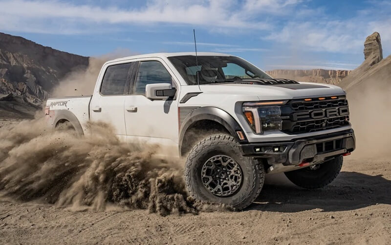 White Ford truck offroading
