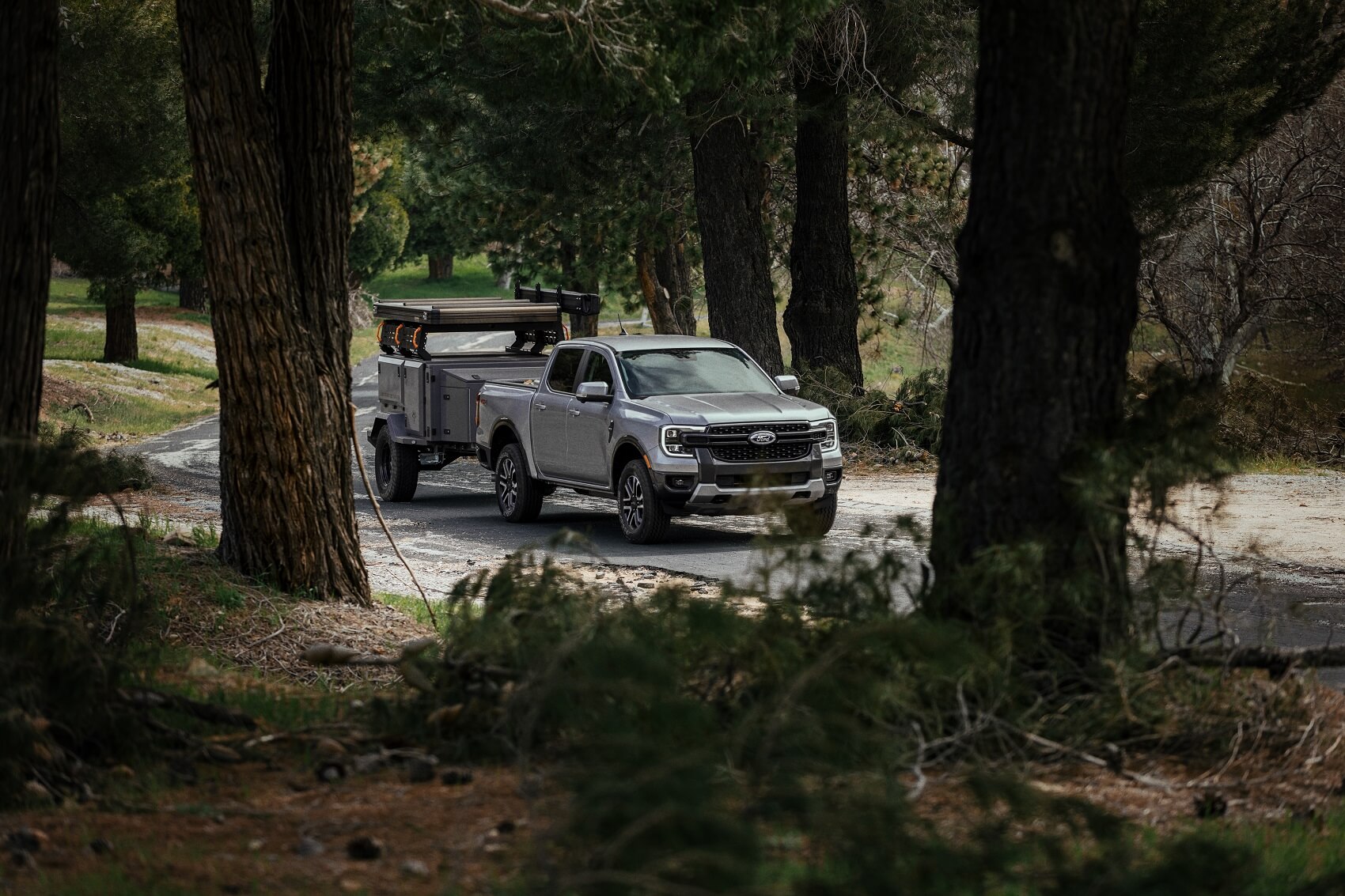 Ford truck towing on road