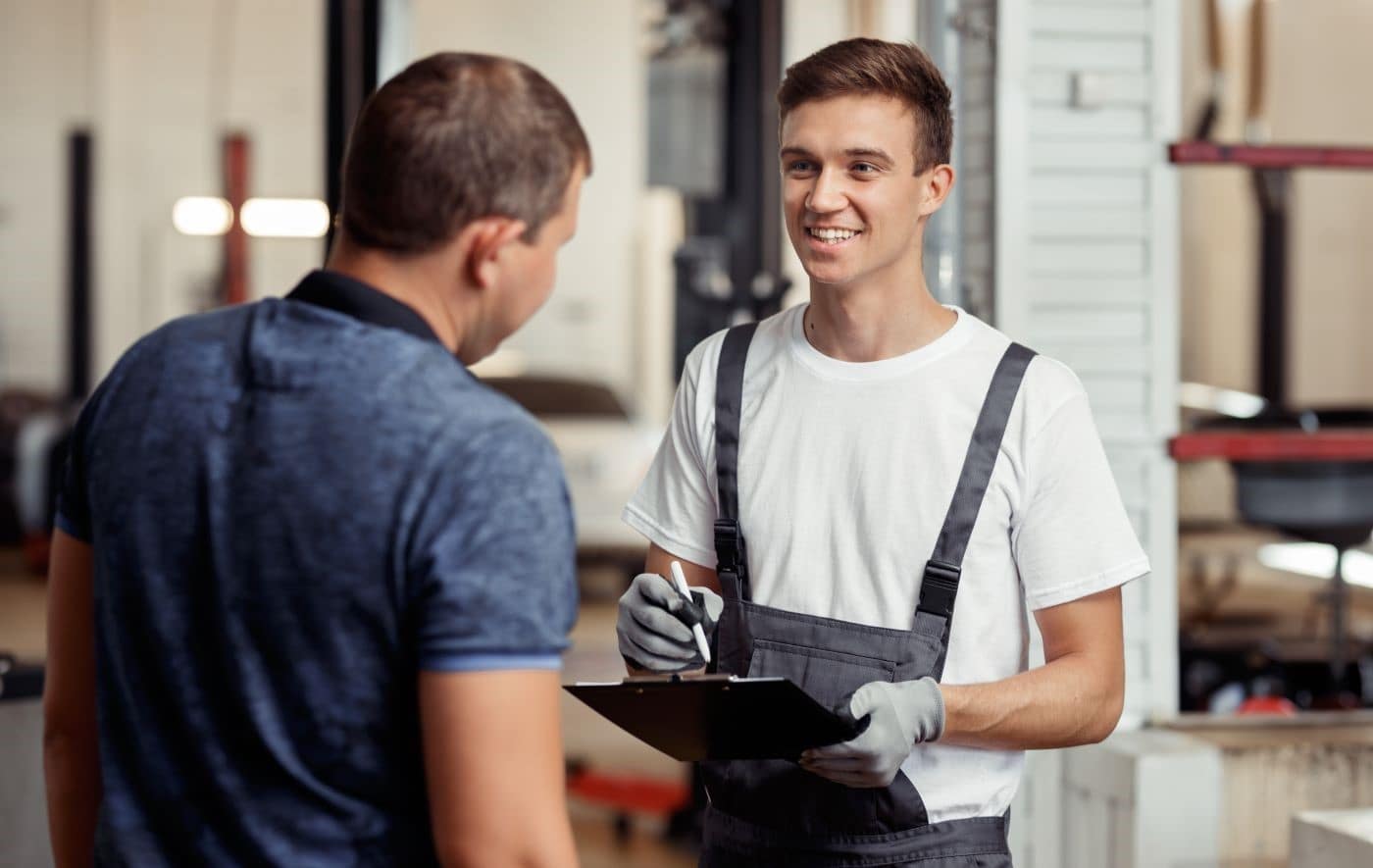 Technician and customer speaking in Service Center