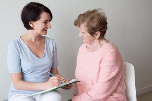 Elderly Female Answering Questions Hand Writing